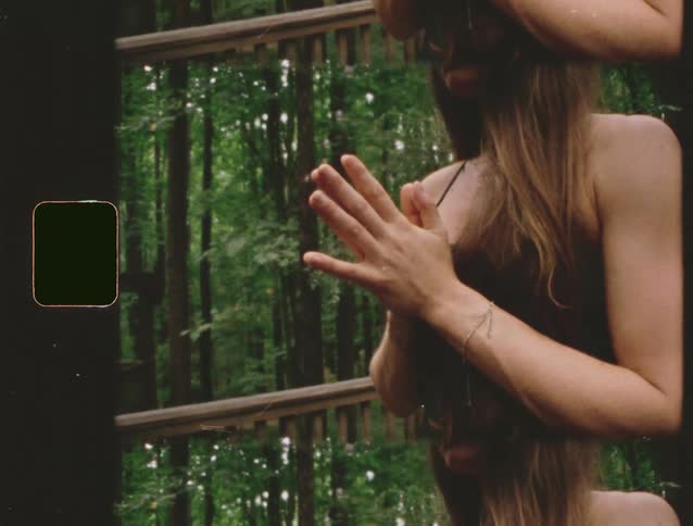 The woman is praying in the forest
