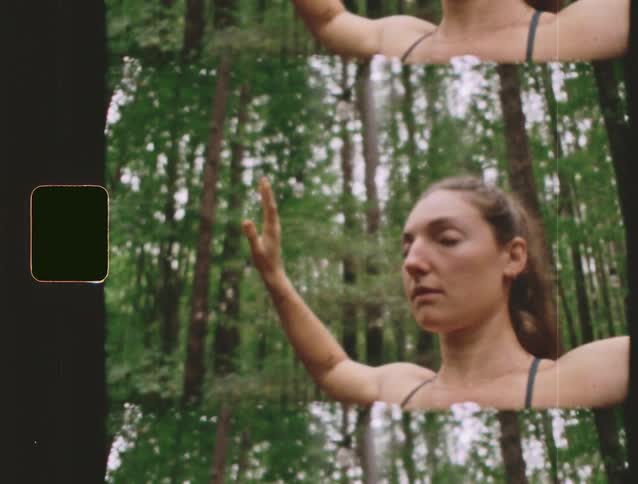 Woman practices yoga in the forest focusing on breathing and gentle movements