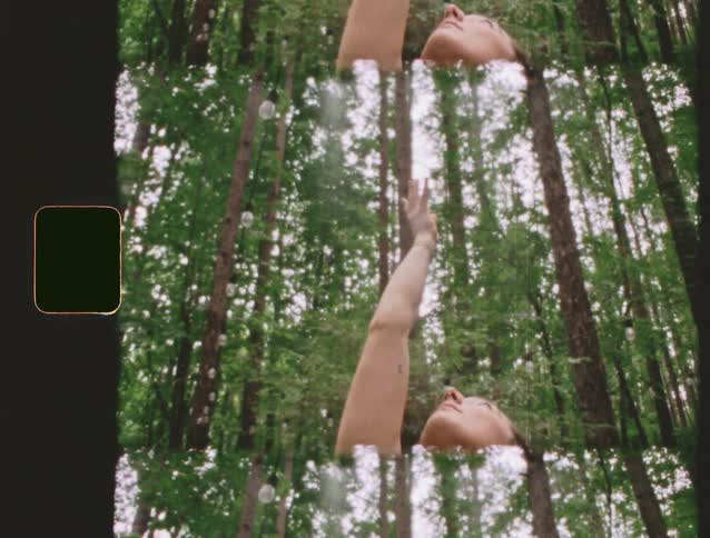 A mobile phone is playing a yoga exercise video