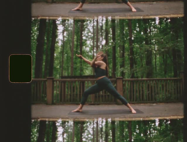 A woman is doing yoga in a clearing in a thick forest