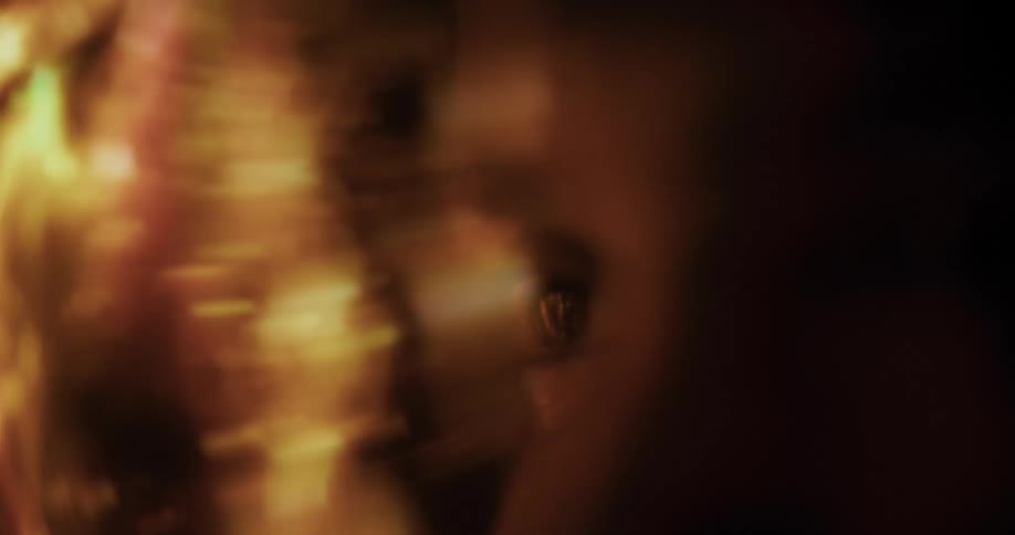 Partial face of a person viewing abstract lights