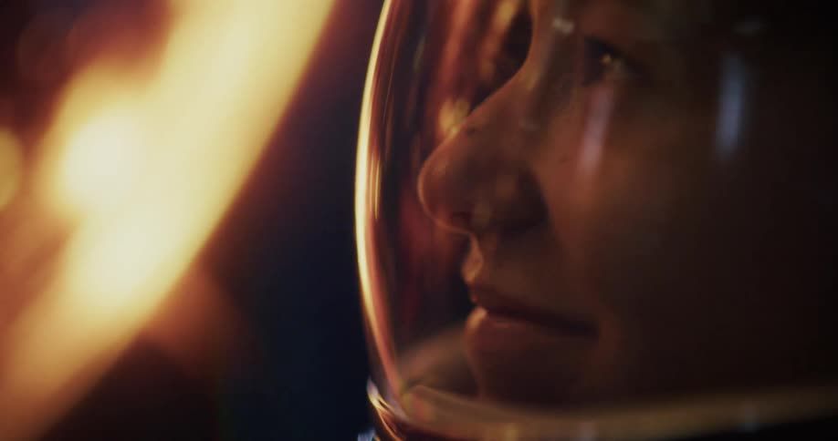 Stylised extreme closeup of an astronaut gazing down at a intense orange planet