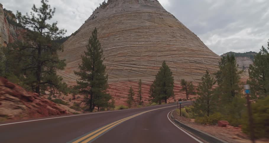 The road is next to the mountains
