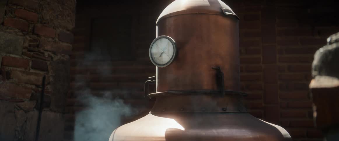 Steam gently rises from a vintage copper still its pressure gauge visible set against a rustic brick background