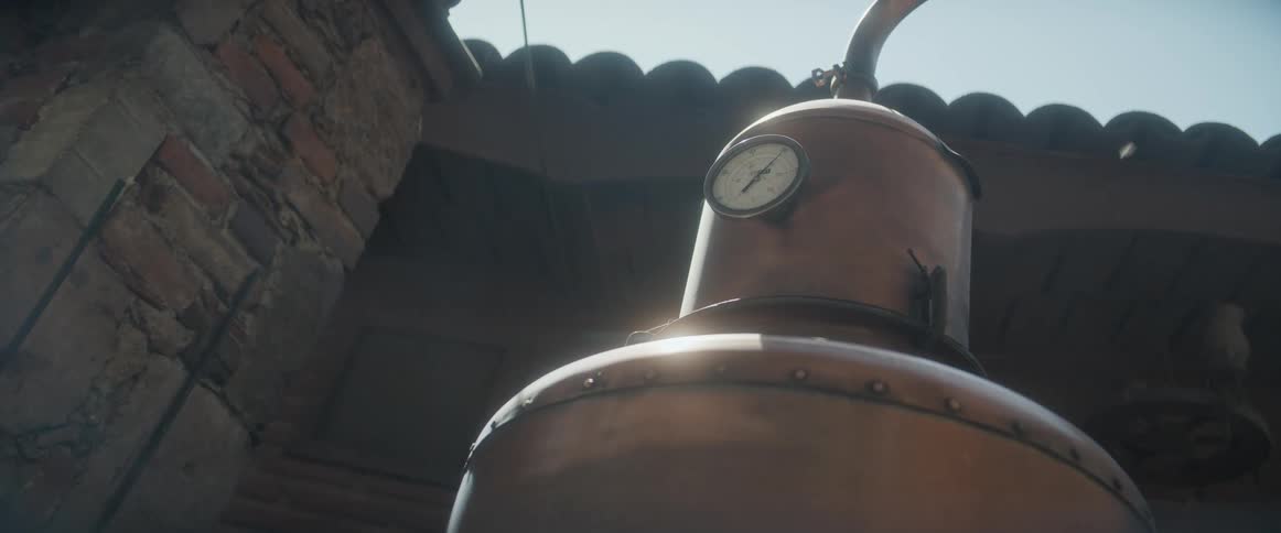 Steam rises from the tank in the brewery