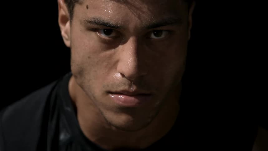 Sweat drips from the face of an angry man