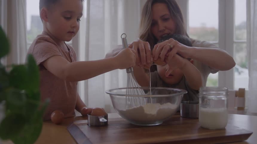 The family cook together at home