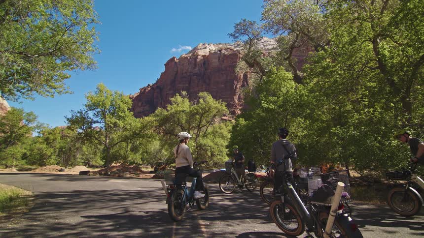 The women get ready to ride their electric bikes in the park