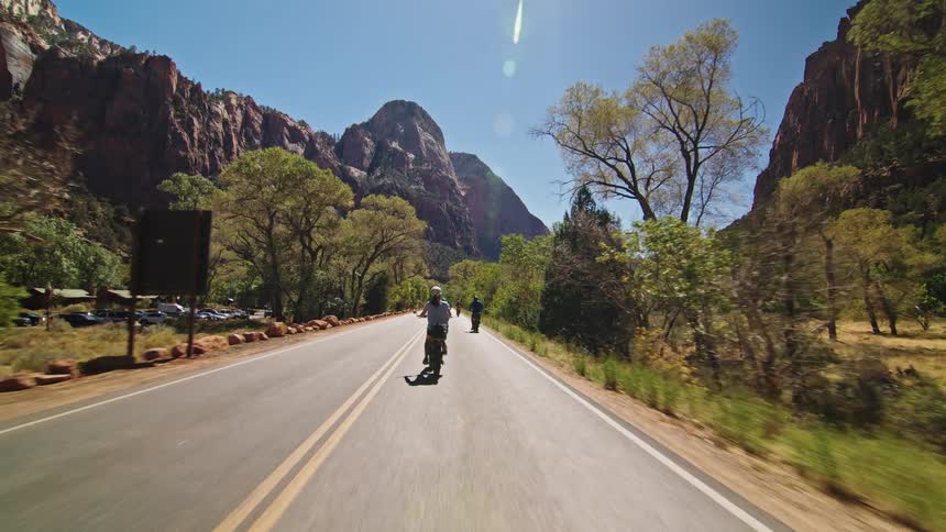 The woman passes people on a bike