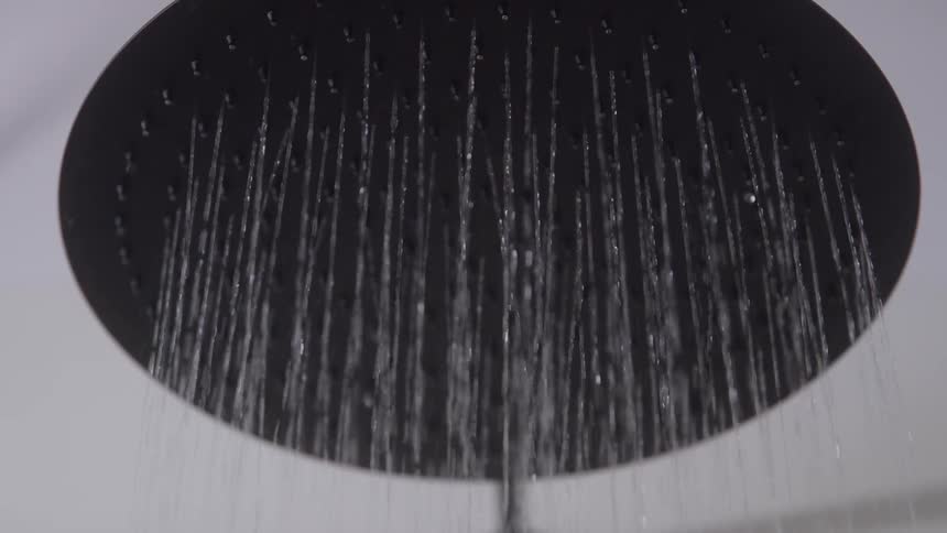 Water is pouring out of the shower head