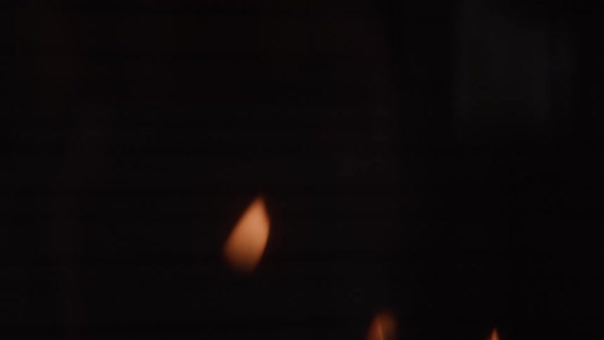 The video is a mediumangle shot of a couple sitting on a large white couch in a bright modern living room the woman is leaning against the mans shoulder and they are both smiling slightly while looking offcamera suggesting they are enjoying a movie