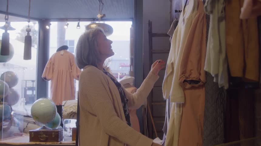 A woman in a clothing store