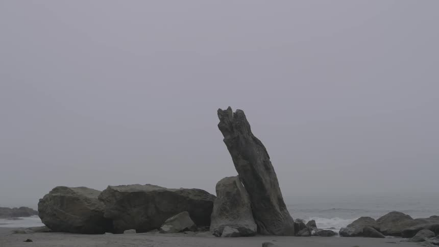 Rocks jutting out of the ground at a beach