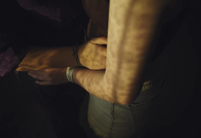 A man and woman holding each other