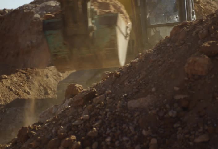 The excavator digs and moves the soul