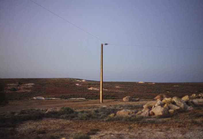 Utility pole on a rural dirt road