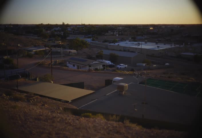 Cars parked in the parking lots of warehouses in an industrial zone