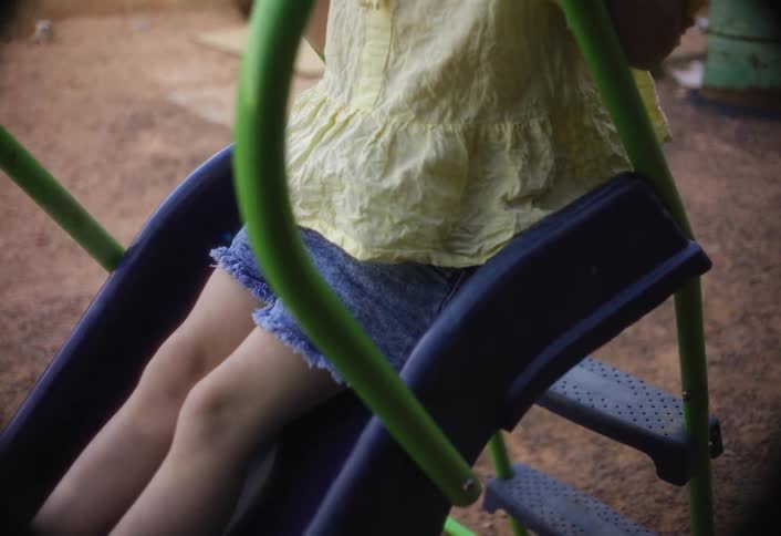 The child slides down the slide