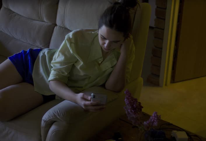The woman is on a video call with her cell phone