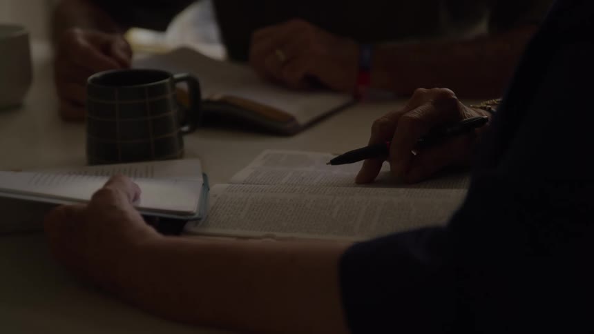The two people are studying with books