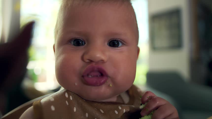 A slow motion portrait of a baby
