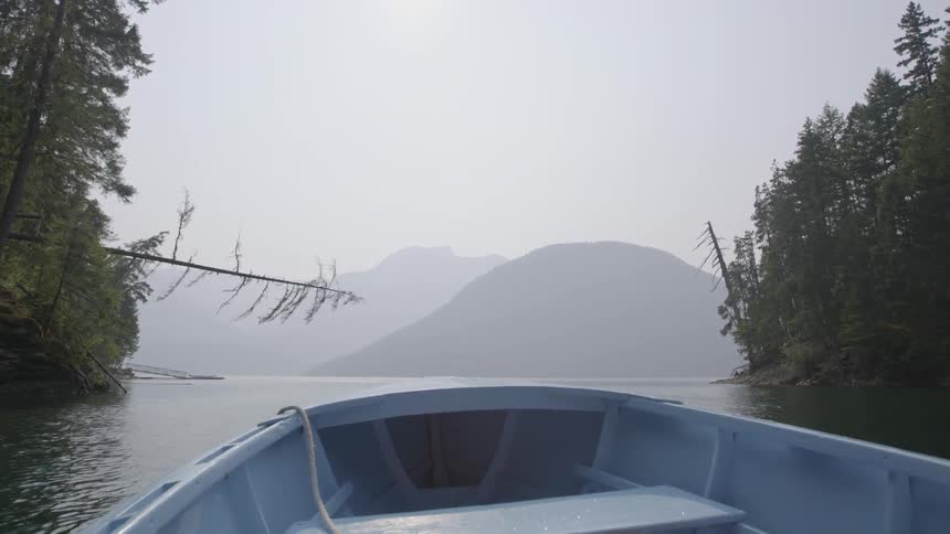 A boat slowly moves in a lake