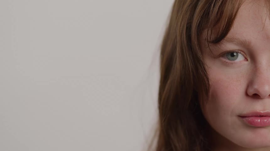 Half of a teenage girls face is shown with the other half out of frame