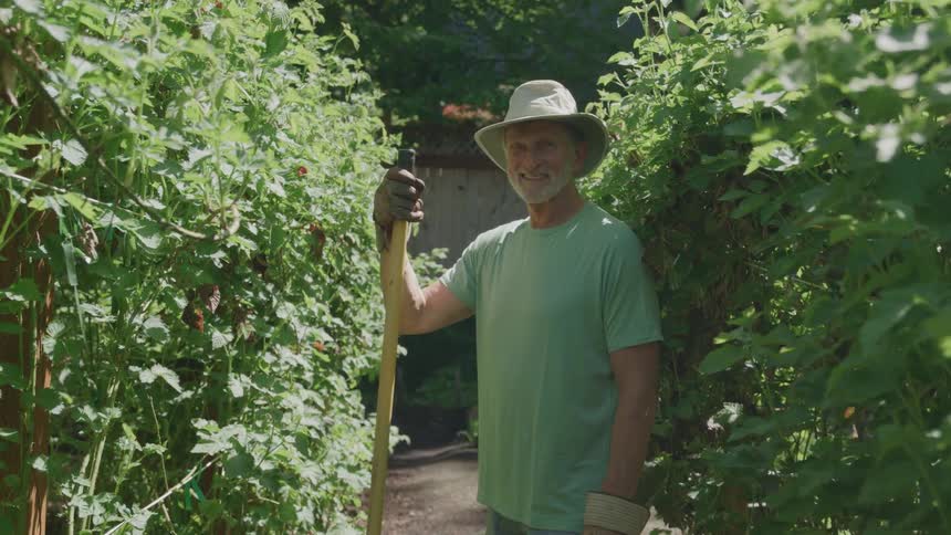 The man smiles on the farm