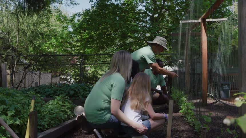A group of people gardening outdoors