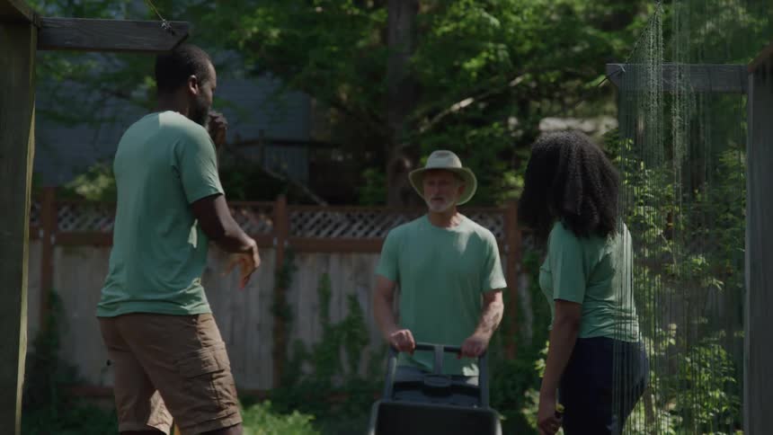 A group of people working in a garden