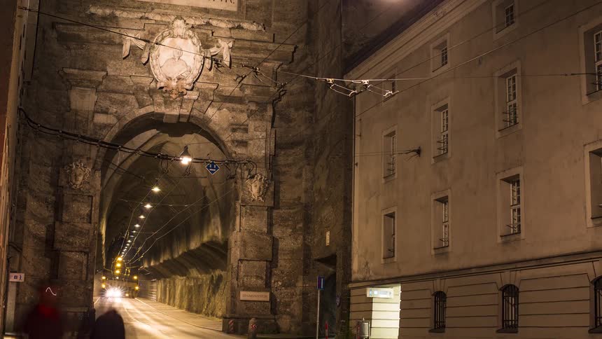 A tunnel in a city at night