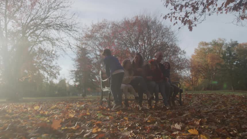 A group of kids running in a park