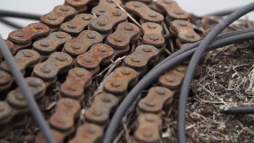 A rusty bike chain and a black wire