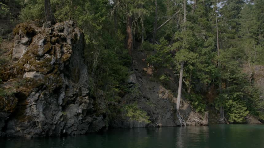 View of rock formations surrounded a lake