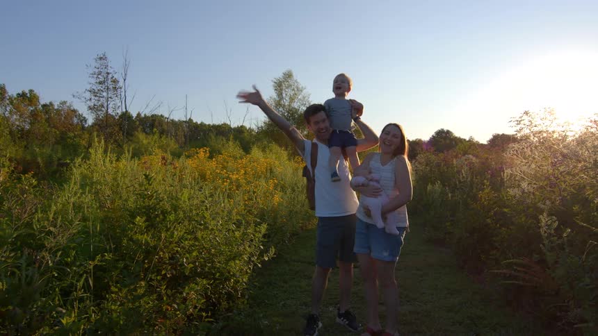 The family wave on the field