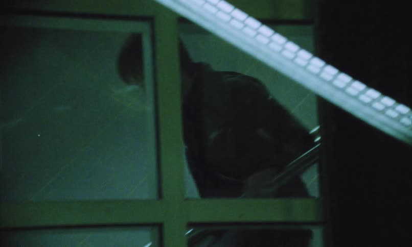 Man running down the stairs in a dimly lit indoor setting