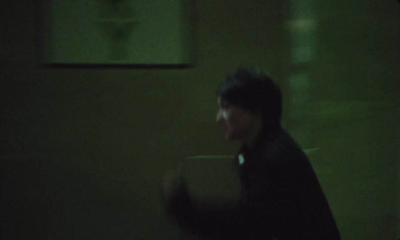 A man and a woman running through the city streets