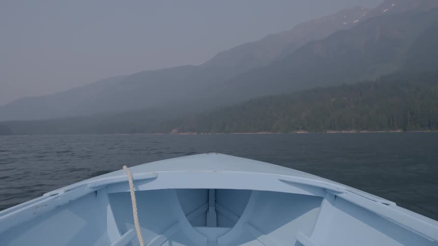 The prow of a boat heading towards land