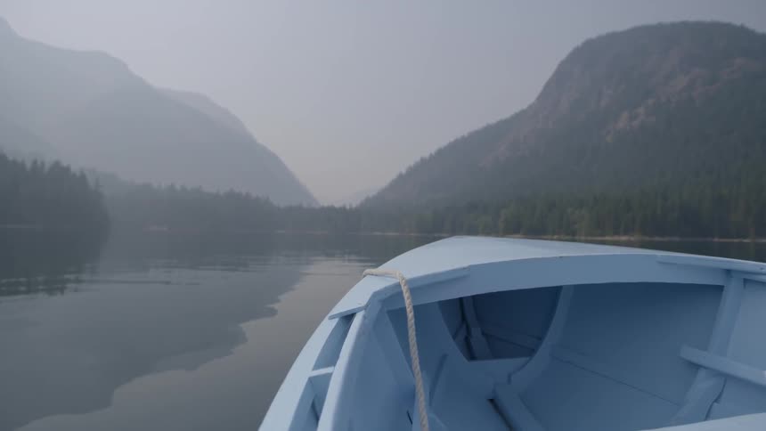 A boat's prow turns toward land