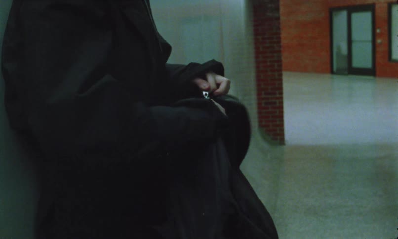 A woman in a hallway