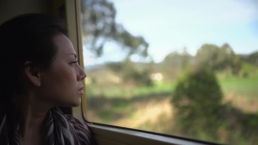 Woman sitting looking out of a window