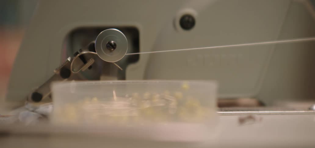 Thread moves fast onto a bobbin on a sewing machine