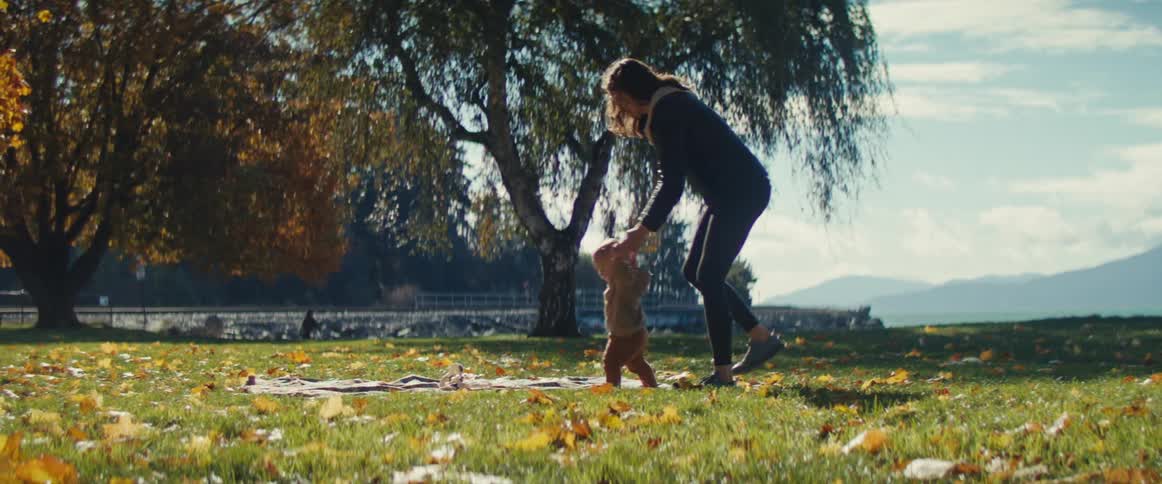 A mother and her child are at a park