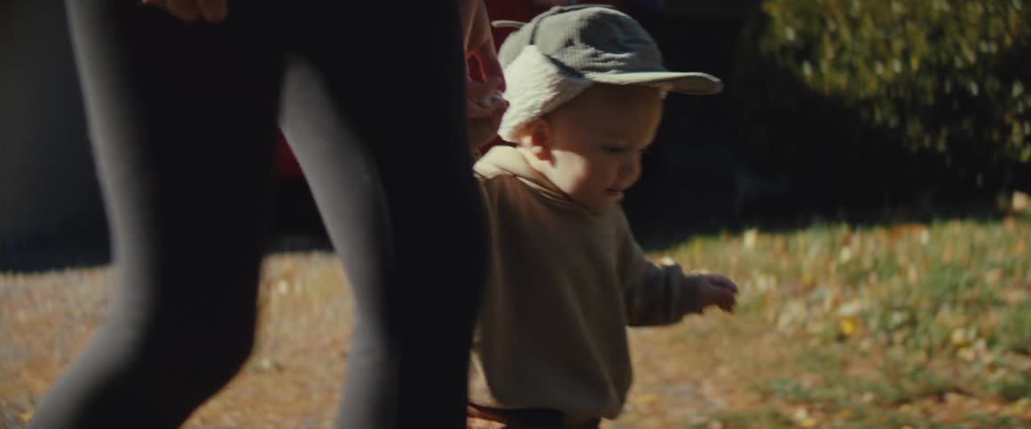 A mother and son walking outdoors