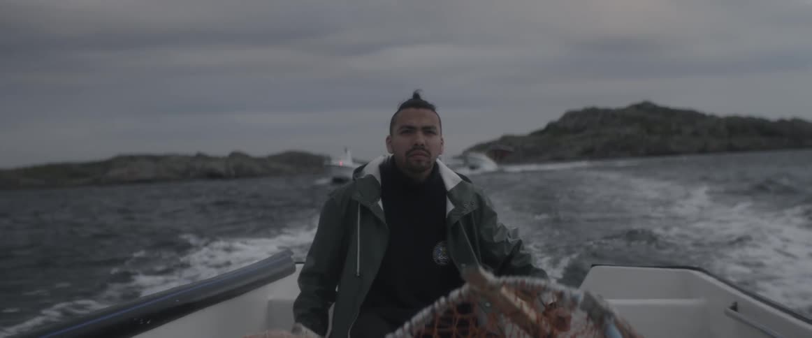 A man is riding on a boat