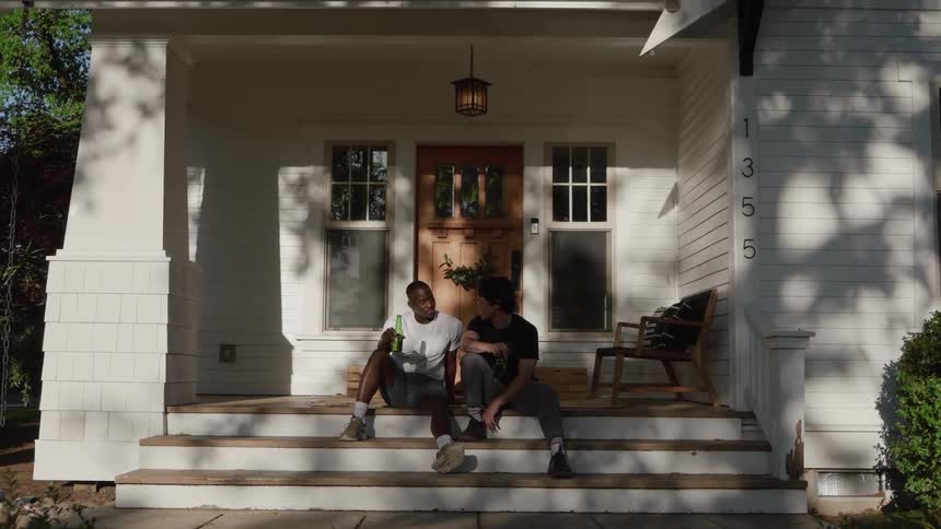 Relaxed toast between friends on the porch