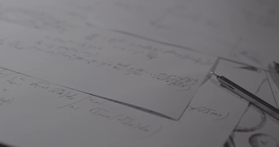 Papers on a desk with a compass
