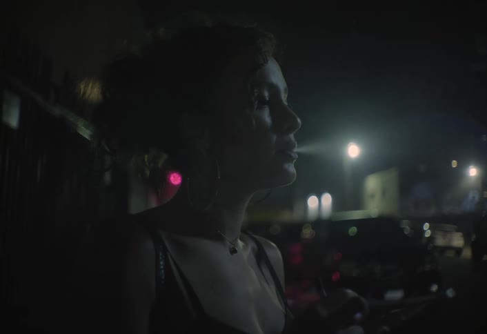 Woman smoking at night