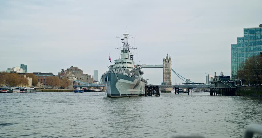 A military ship is docked near london as a tourist attraction