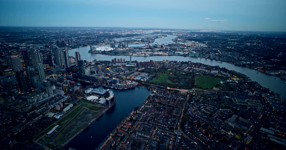 An extremely wide aerial shot of the winding thames river through a major city